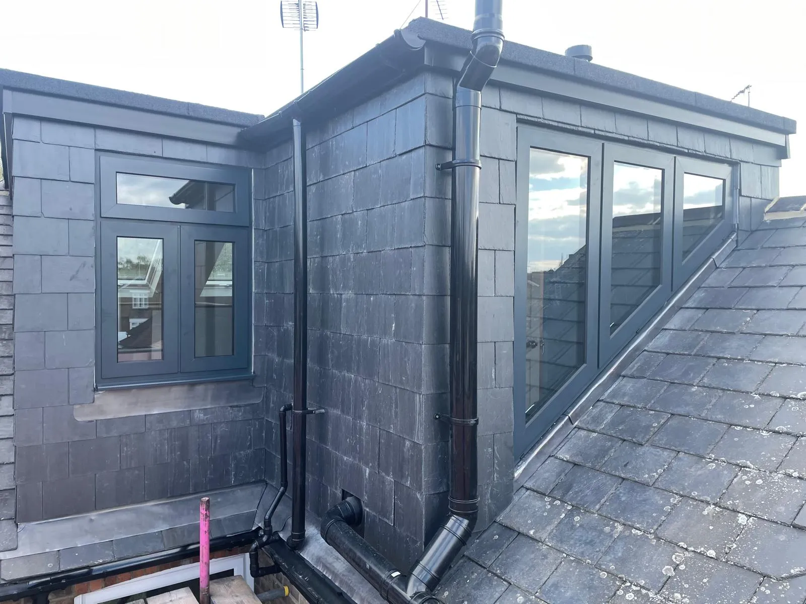 Grey dormer conversion with matching grey window frames