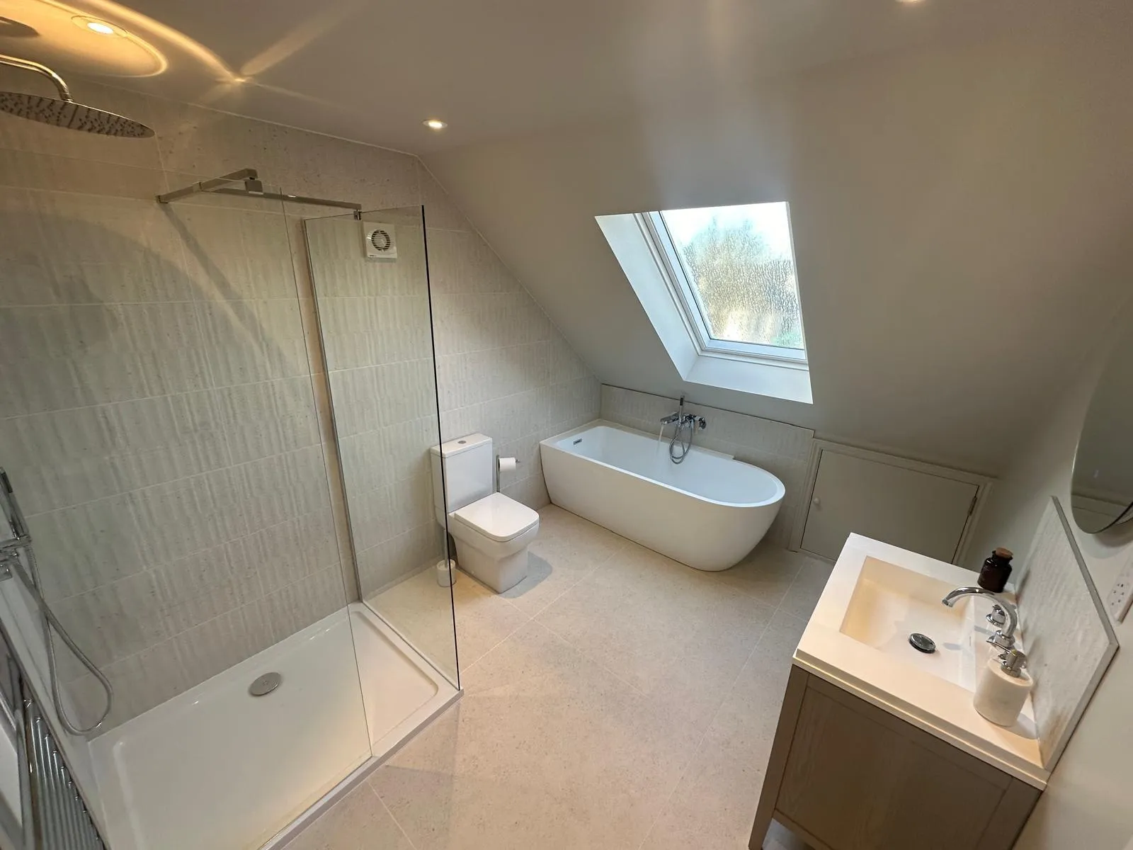 Bright loft bathroom with walk-in shower and bathtub