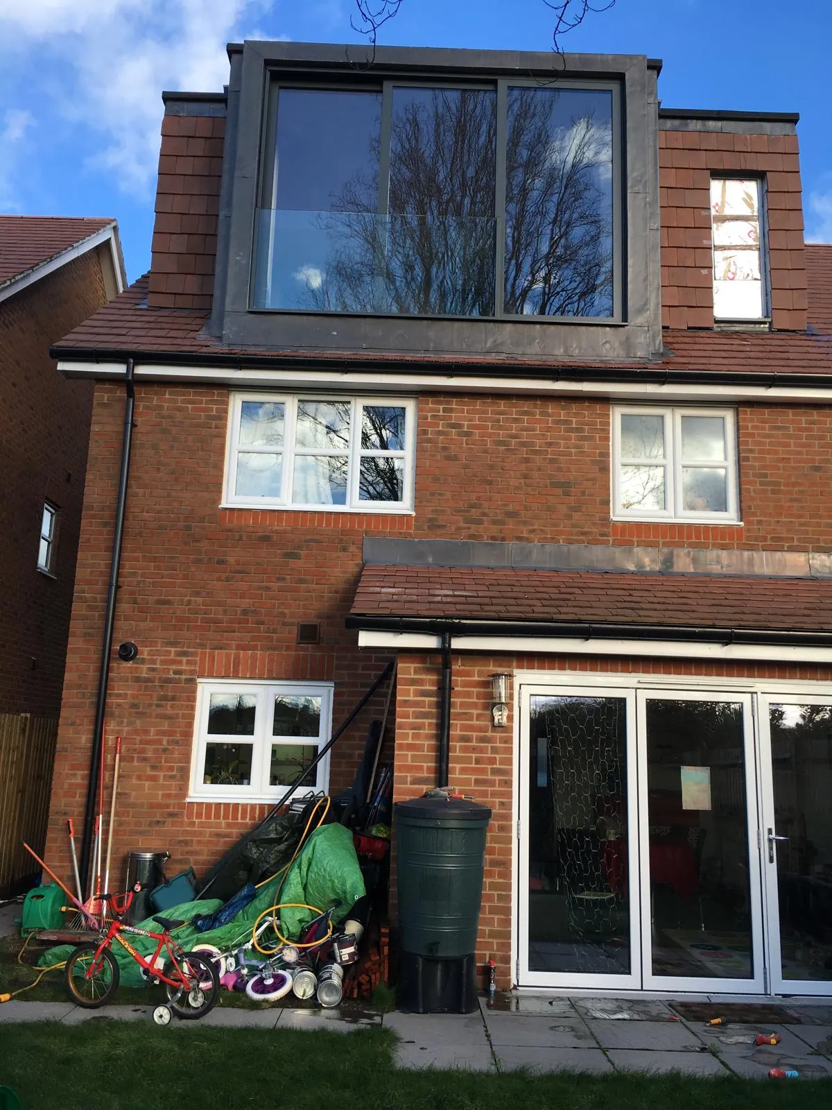 Modern dormer loft conversion with large glass window