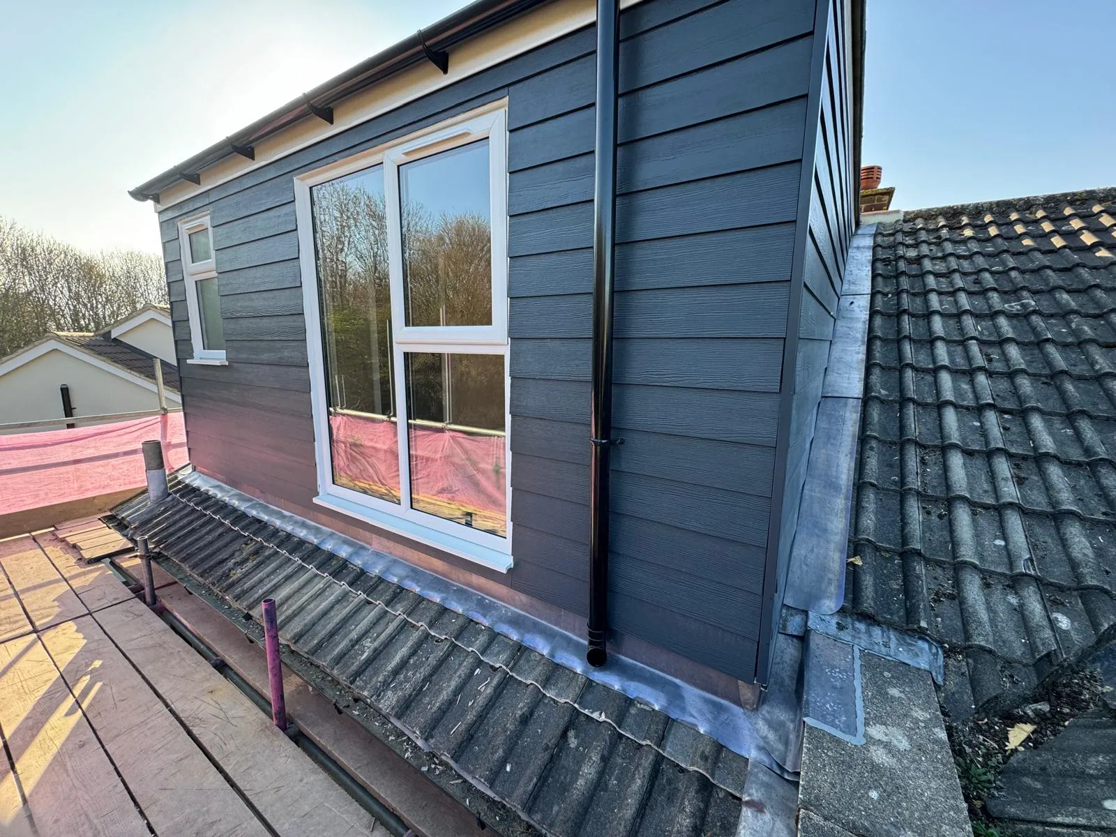 Modern dark grey cladding on loft conversion roof