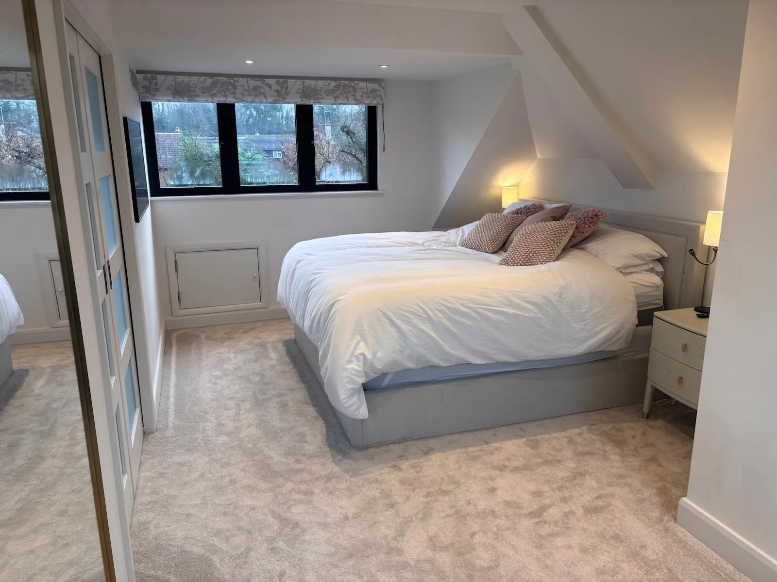 Cosy carpeted loft conversion bedroom interior